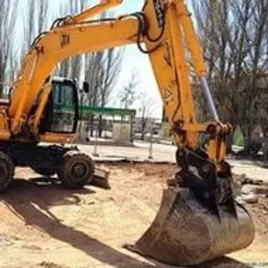 Услуги,  аренда,  заказ колесного экскаватора 